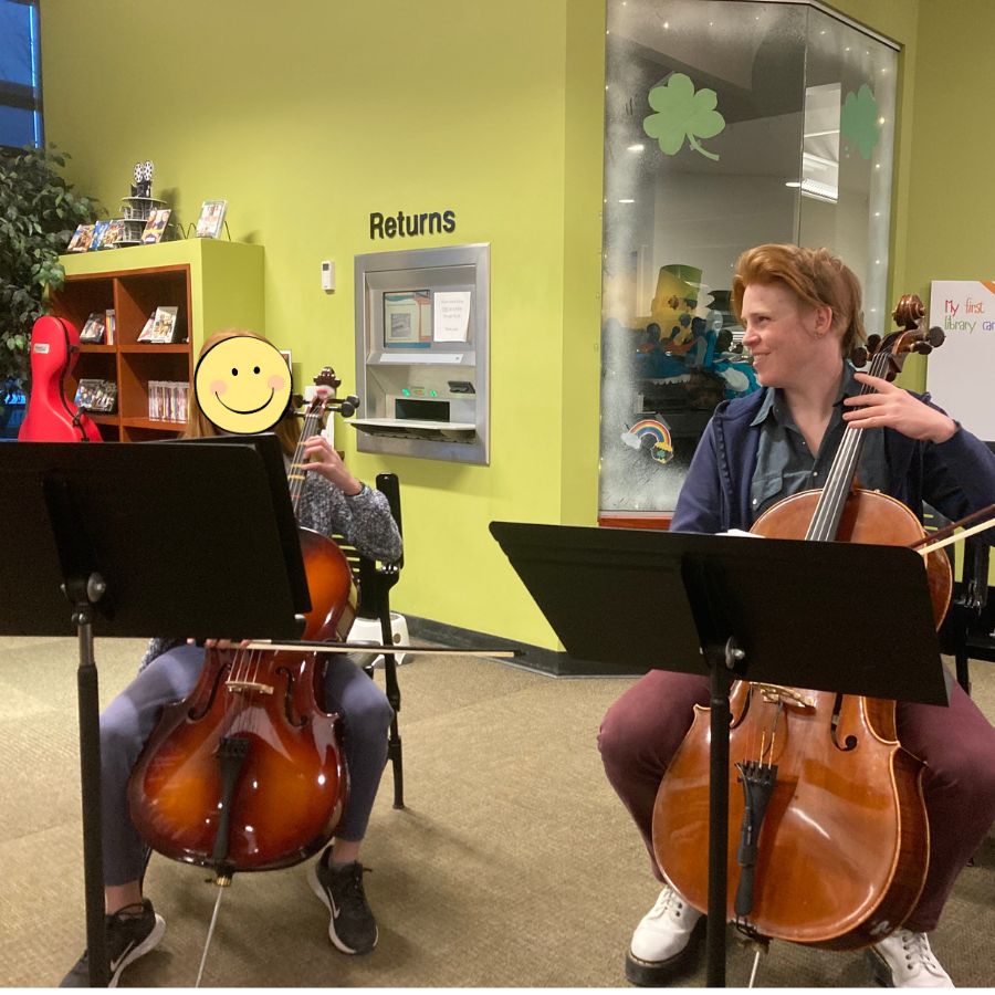 Performing a duet with a beginner cello student.